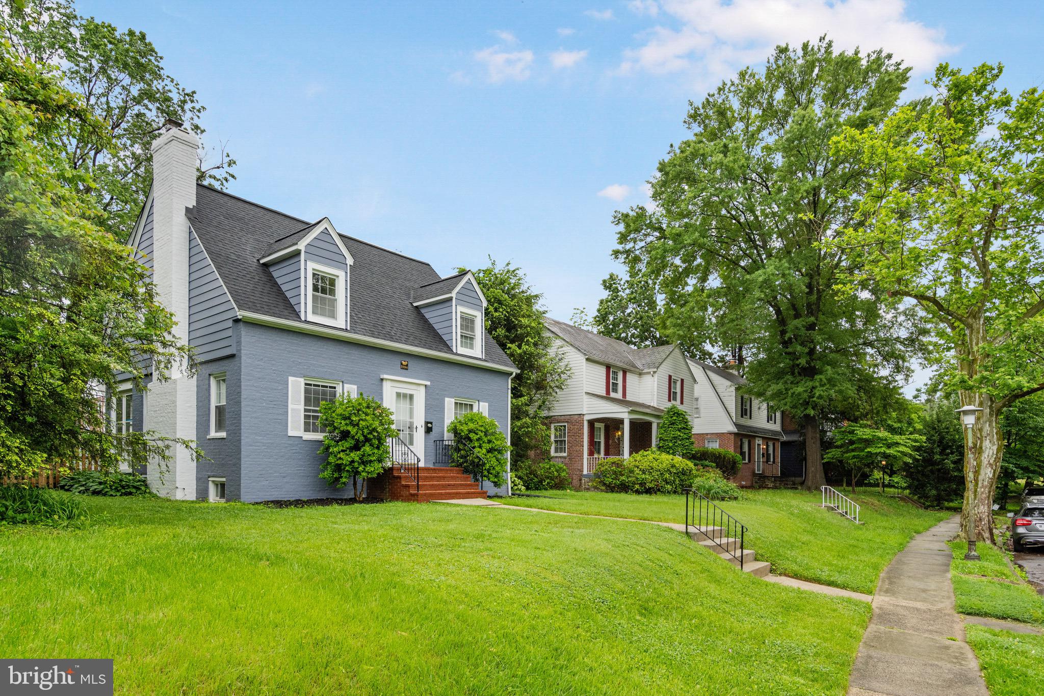 5311 Herring Run Drive Baltimore, MD 21214 - Photo 2 of 43 a front view of a house with a garden and yard