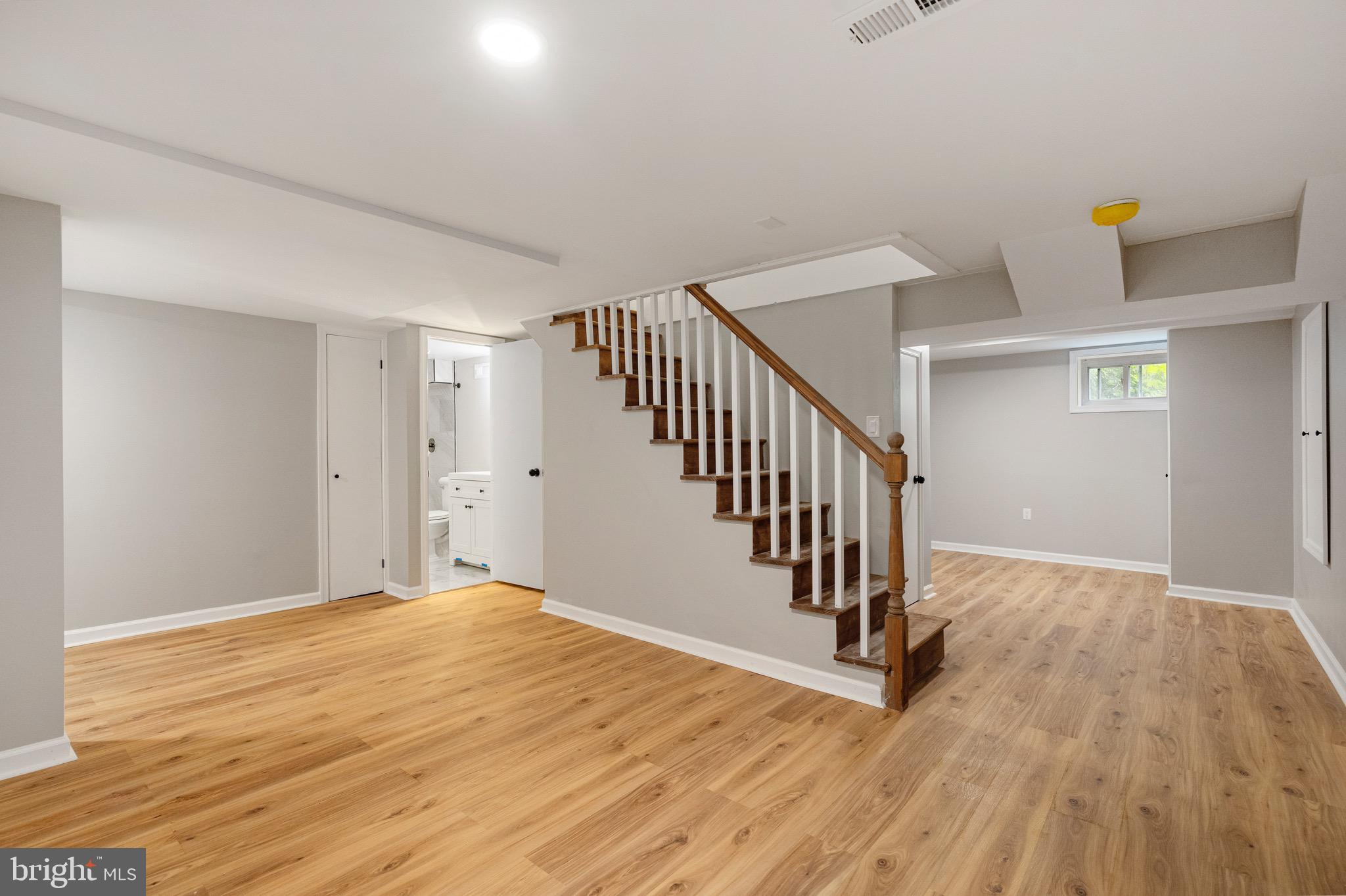 5311 Herring Run Drive Baltimore, MD 21214 - Photo 21 of 43 a view of a room with wooden floor and stairs