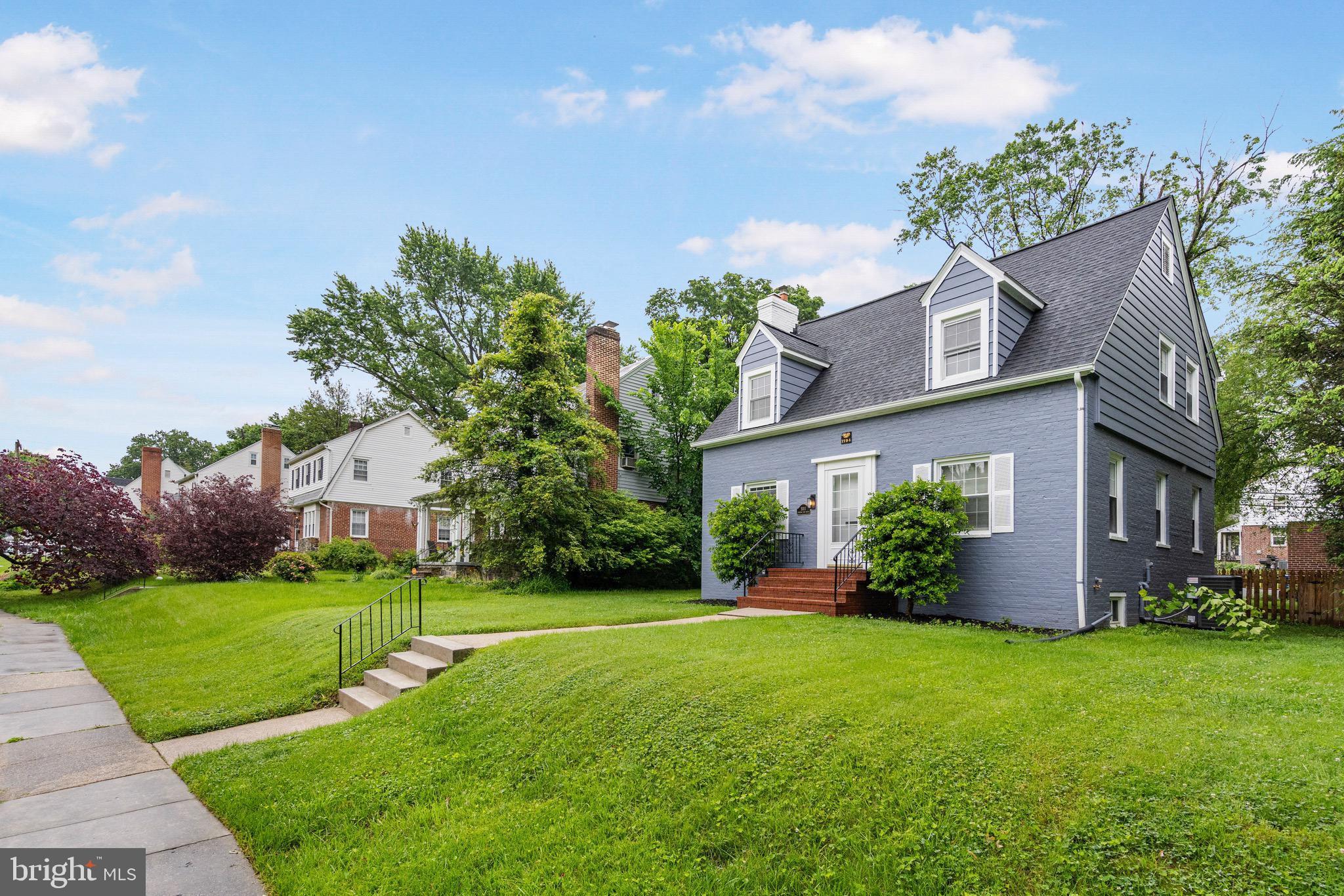5311 Herring Run Drive Baltimore, MD 21214 - Photo 3 of 43 a front view of a house with garden