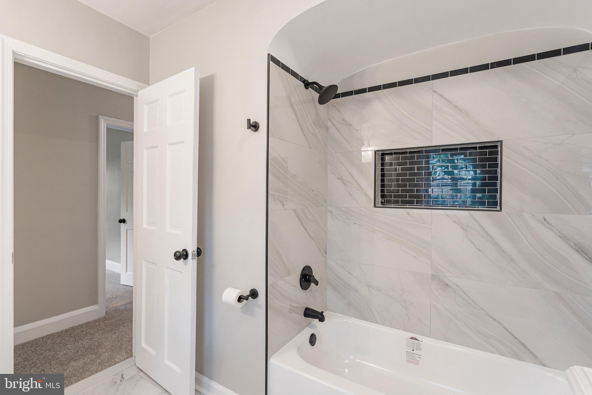 5311 Herring Run Drive Baltimore, MD 21214 - Photo 35 of 43 a bathroom with a shower and a bathtub