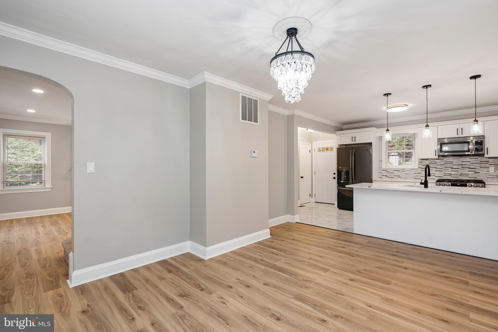 5311 Herring Run Drive Baltimore, MD 21214 - Photo 6 of 43 a view of empty room with wooden floor and window