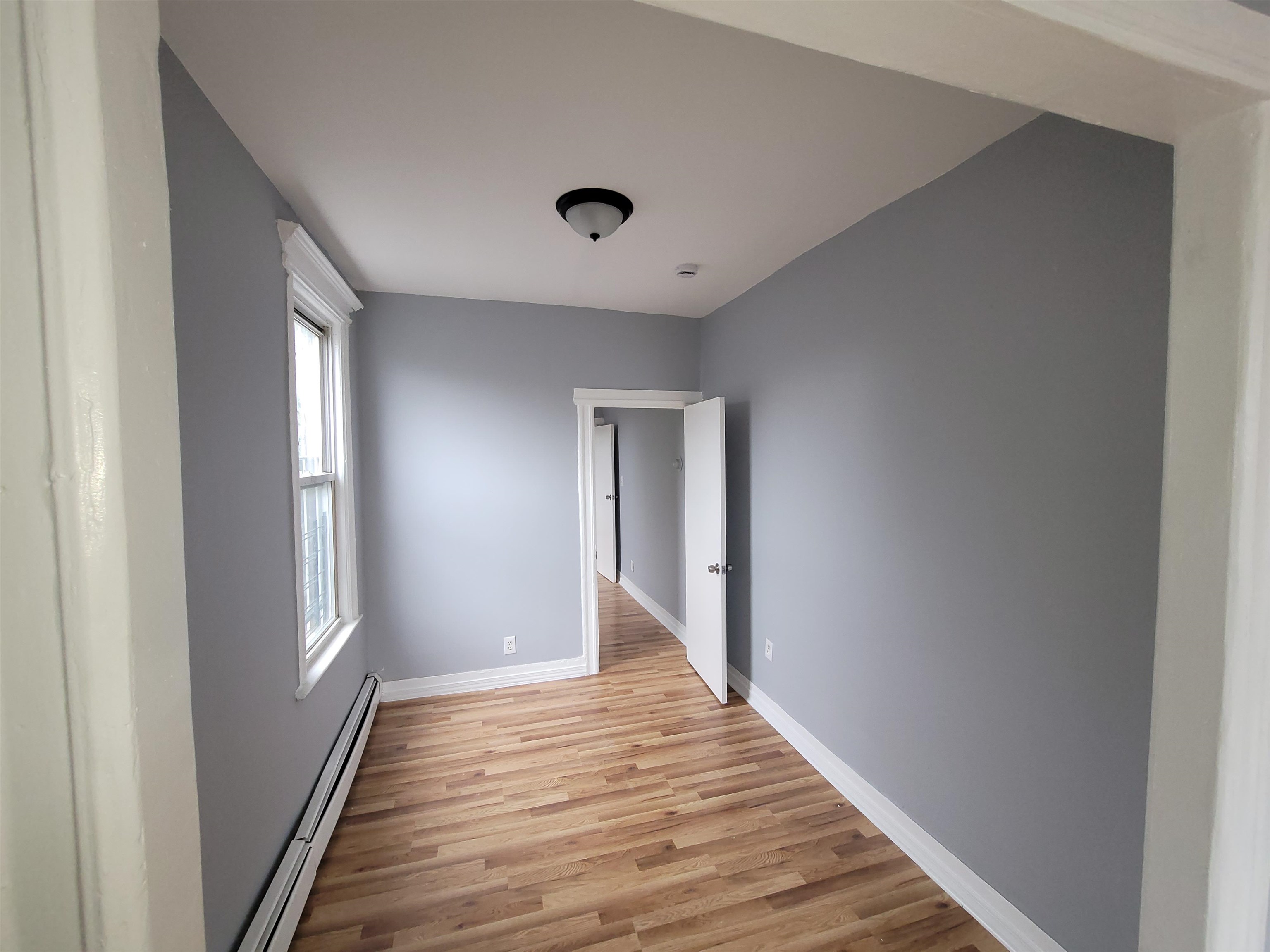 1700 John F. Kennedy Boulevard, Unit 3L Jersey City, NJ 07305 - Photo 9 of 13 a view of a hallway with wooden floor