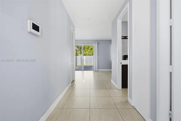 a view of hallway with a white walls