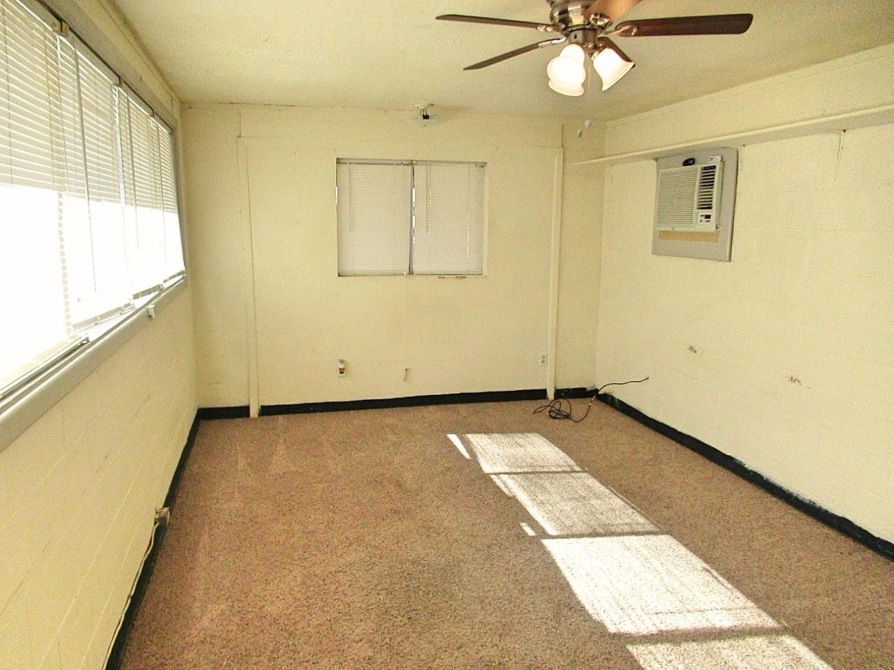 2220 29th Street, Unit R Lubbock, TX 79411 - Photo 1 of 4 a view of an empty room with a window