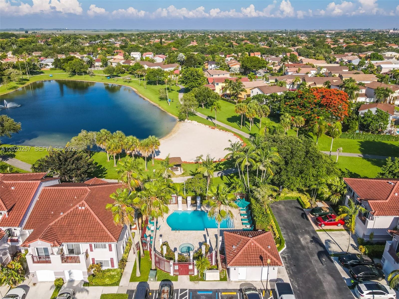 10245 Southwest 154th Place, Unit 1123 Miami, FL 33196 - Photo 38 of 38 an aerial view of residential houses with outdoor space and lake view