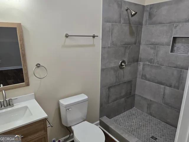 a bathroom with a toilet and a sink