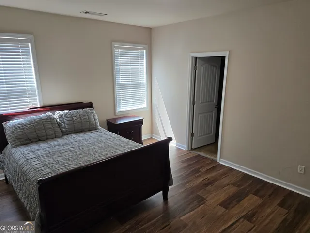 a bathroom with a sink a mirror and a bathtub