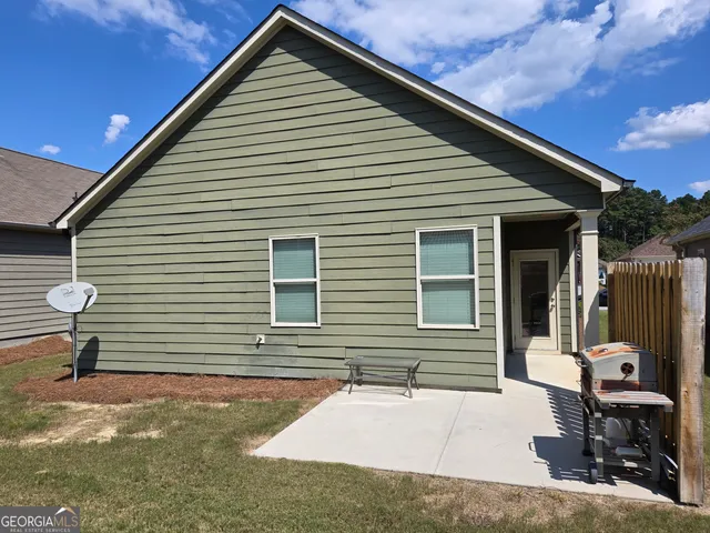 a front view of a house with glass doors