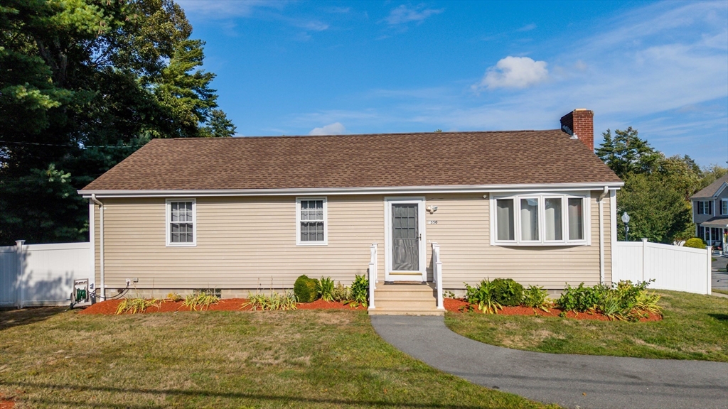 1350 Phillips Road New Bedford, MA 02745 - Photo 1 of 17 a front view of a house with garden