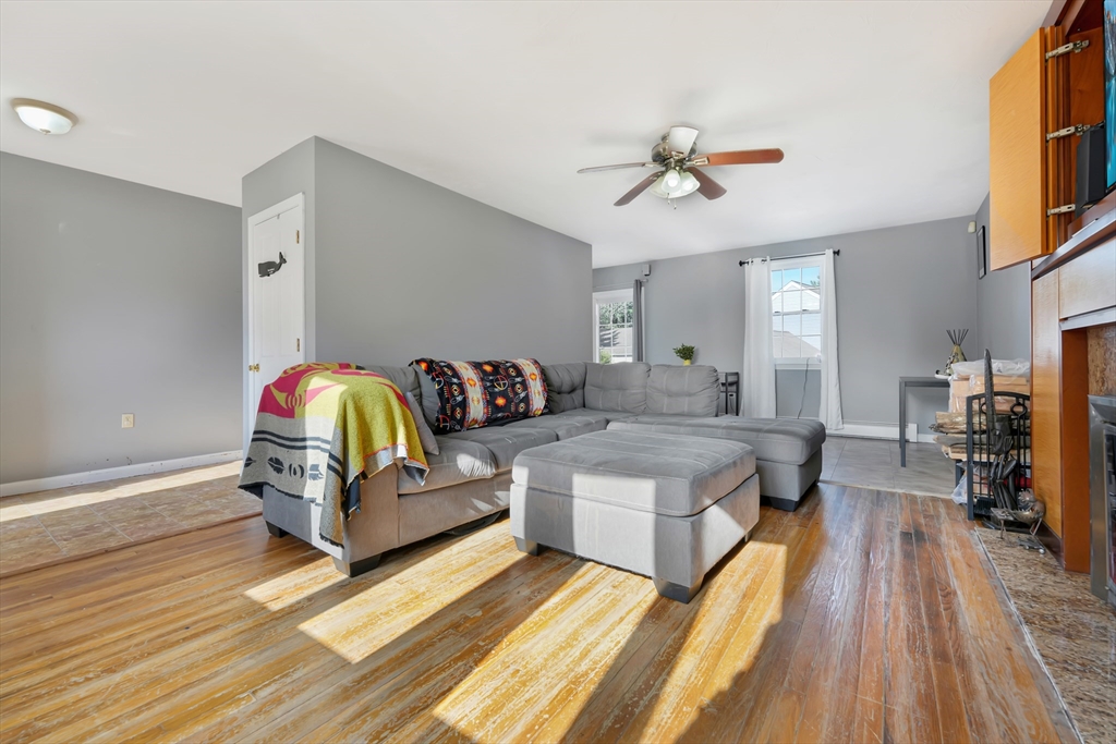 1350 Phillips Road New Bedford, MA 02745 - Photo 3 of 17 a living room with furniture and a wooden floor