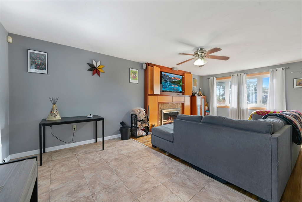 1350 Phillips Road New Bedford, MA 02745 - Photo 5 of 17 a living room with furniture and a flat screen tv