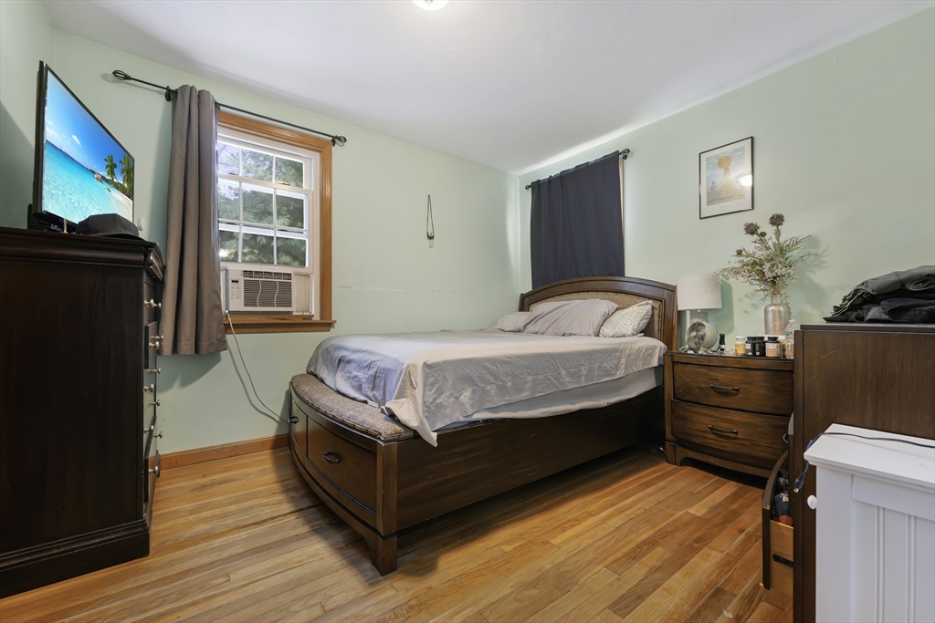 1350 Phillips Road New Bedford, MA 02745 - Photo 7 of 17 a bedroom with a bed window and dresser