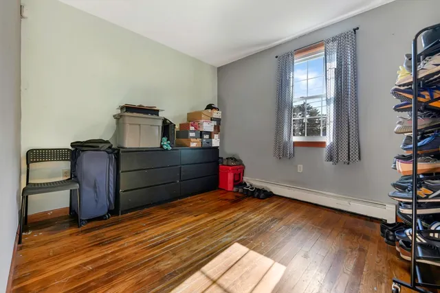 a room with wooden floor and closet