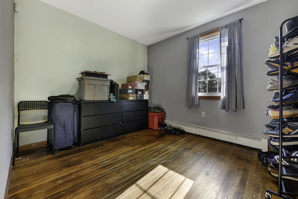 1350 Phillips Road New Bedford, MA 02745 - Photo 8 of 17 a room with wooden floor and closet