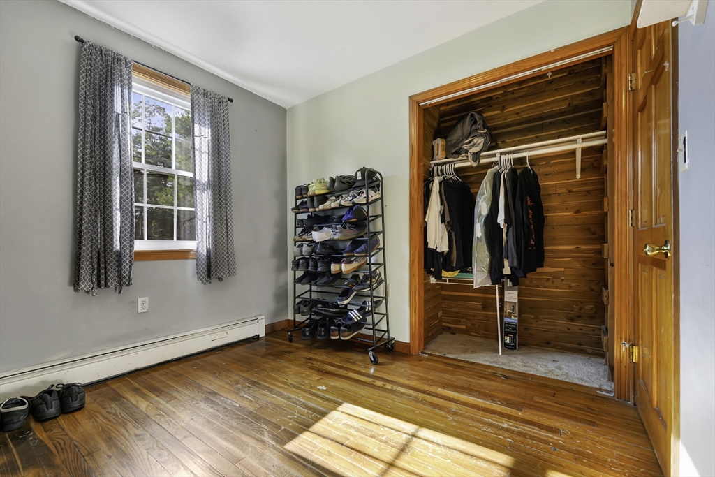 1350 Phillips Road New Bedford, MA 02745 - Photo 9 of 17 a view of walk in closet with clothes and shoes