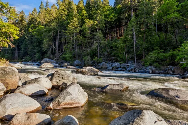 a view of swimming pool with a yard
