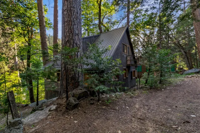 a backyard of a house with lots of green space