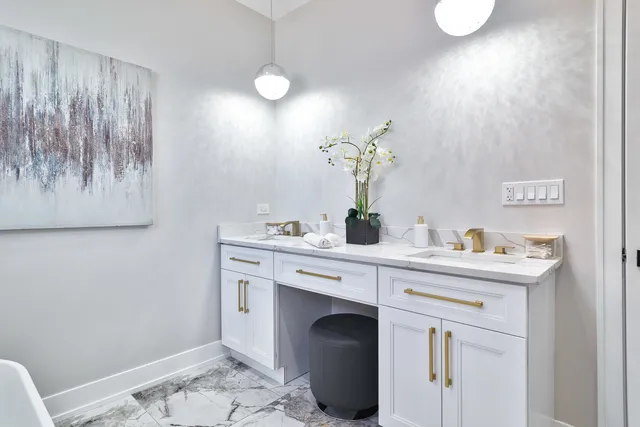 a room with a sink and a mirror