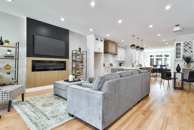 a living room with fireplace furniture and a flat screen tv