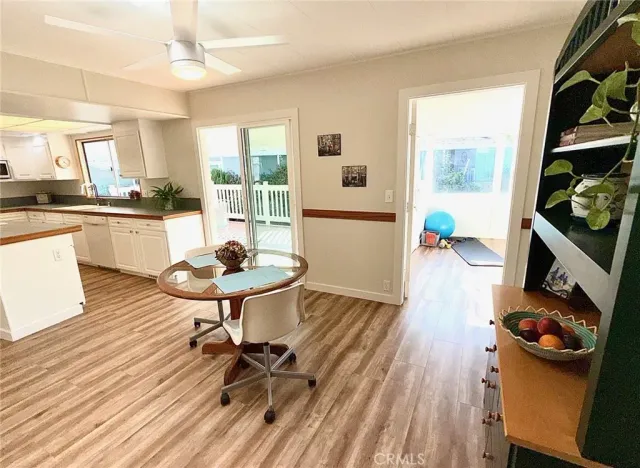 a view of balcony with wooden floor and fence