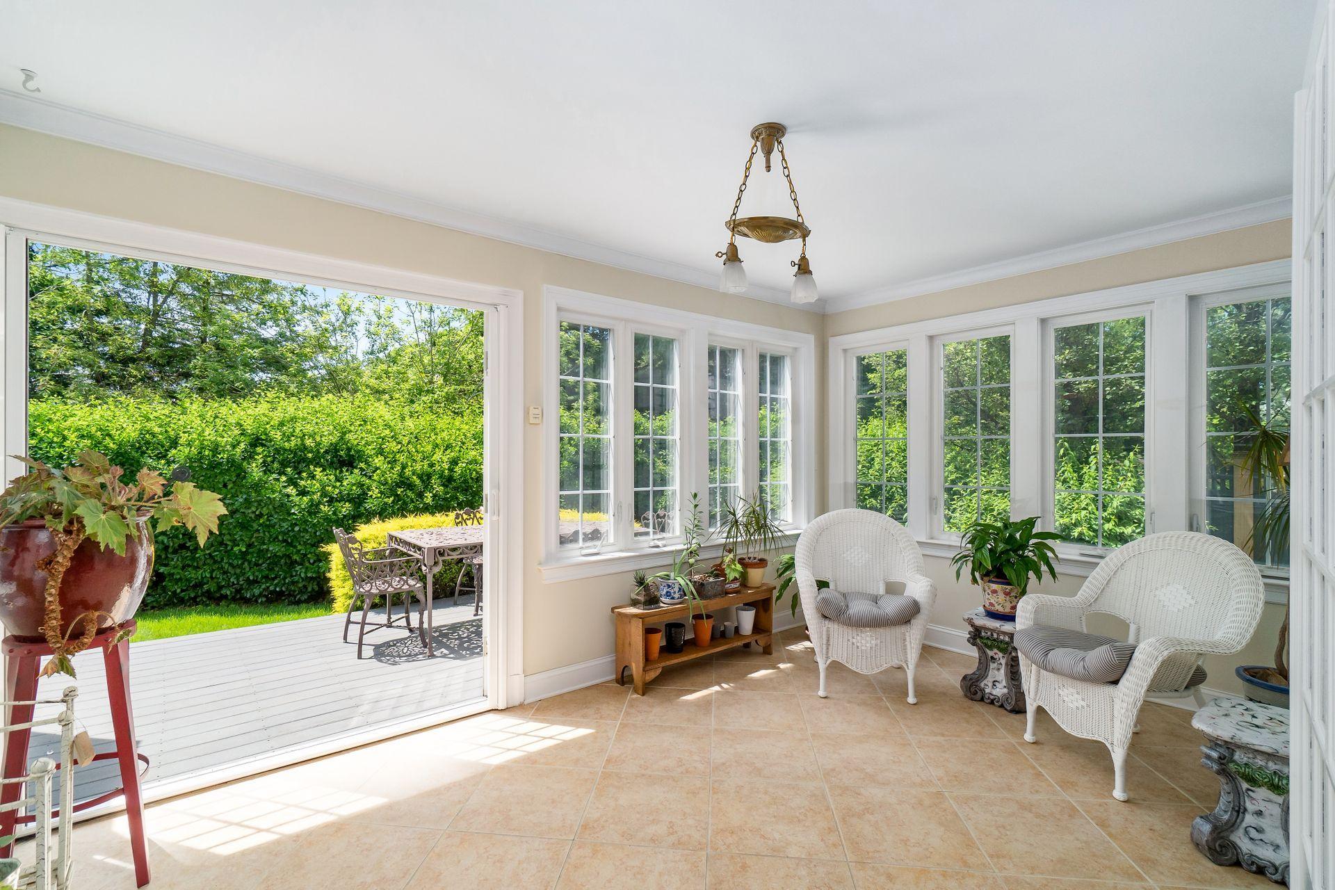 33 Pine Point Road Rowayton, CT 06853 - Photo 12 of 28 a living room with furniture and a floor to ceiling window