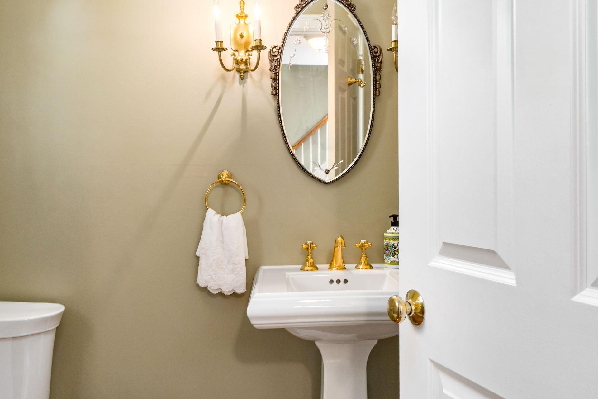 33 Pine Point Road Rowayton, CT 06853 - Photo 13 of 28 a bathroom with a sink and a mirror