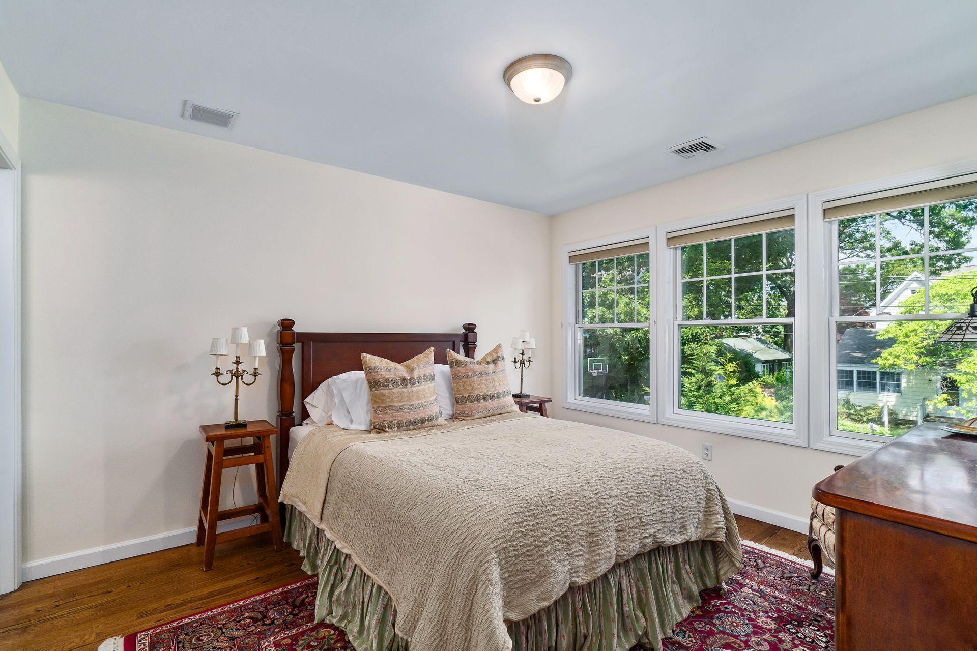 33 Pine Point Road Rowayton, CT 06853 - Photo 19 of 28 a bedroom with a bed and a window