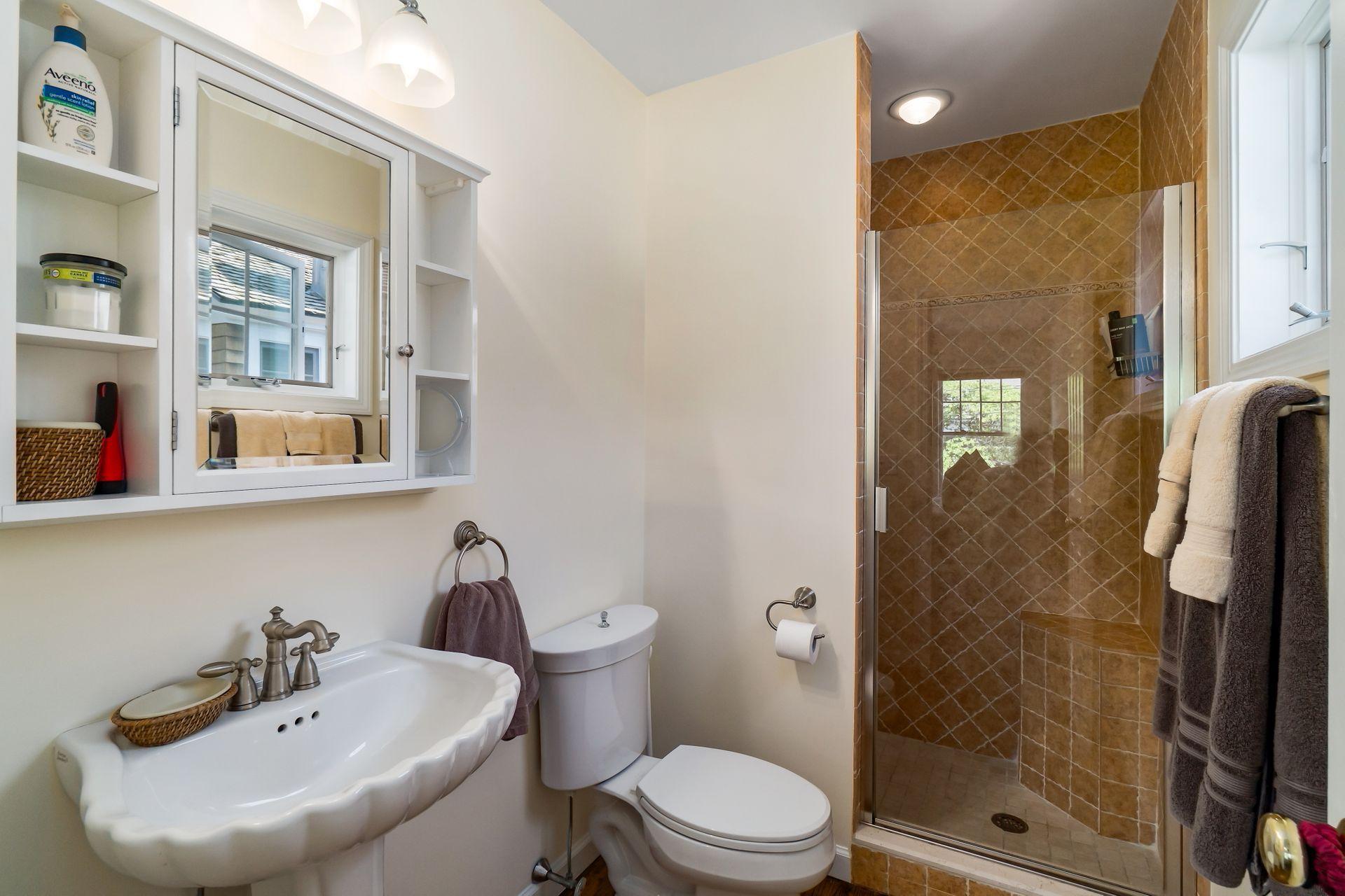 33 Pine Point Road Rowayton, CT 06853 - Photo 20 of 28 a bathroom with a sink toilet and shower
