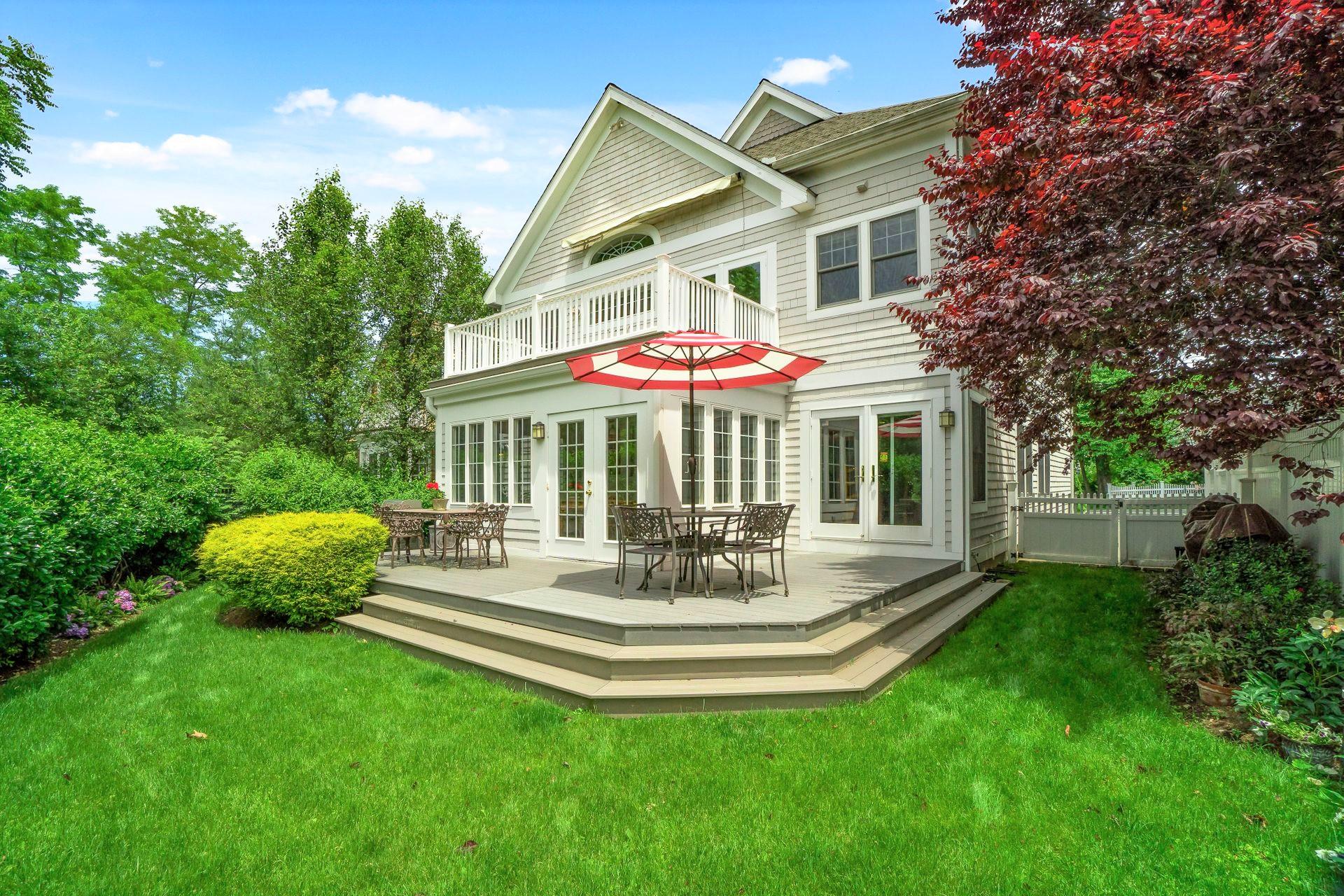 33 Pine Point Road Rowayton, CT 06853 - Photo 2 of 28 a view of a house with a yard table and chairs