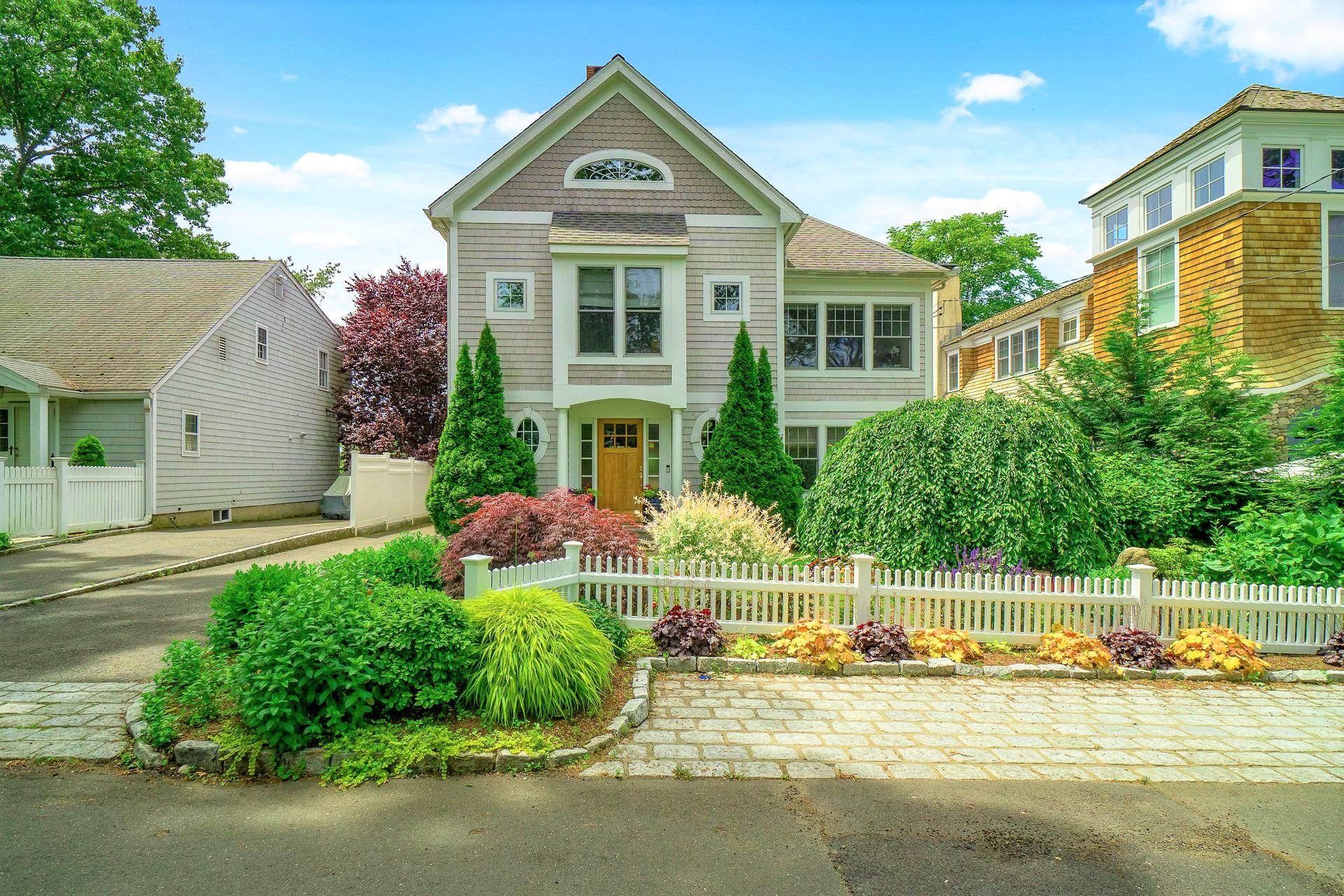 33 Pine Point Road Rowayton, CT 06853 - Photo 3 of 28 a front view of a house with a yard