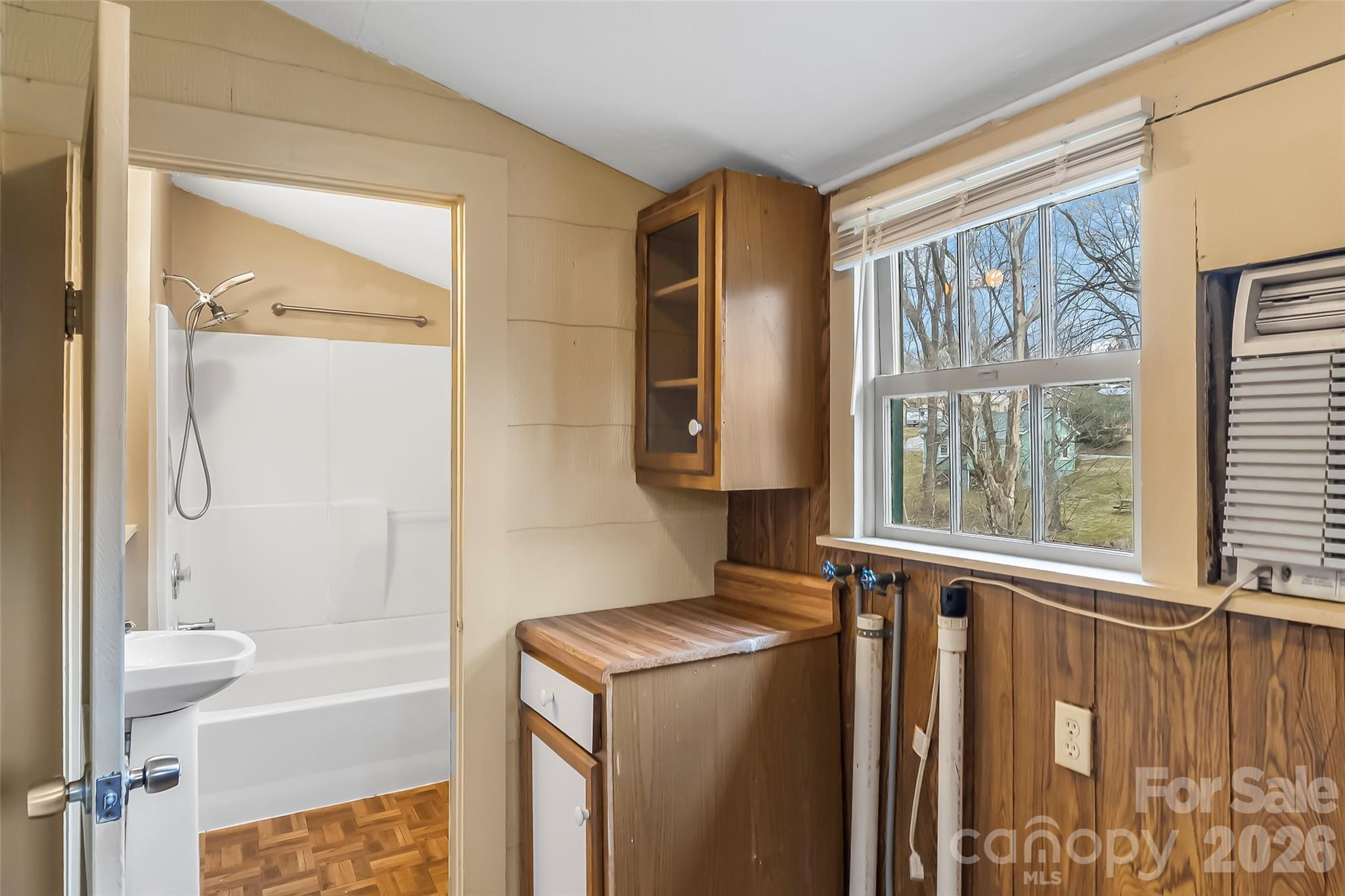 102 Rhododendron Drive Brevard, NC 28712 - Photo 11 of 17 a bathroom with a bathtub and a shower