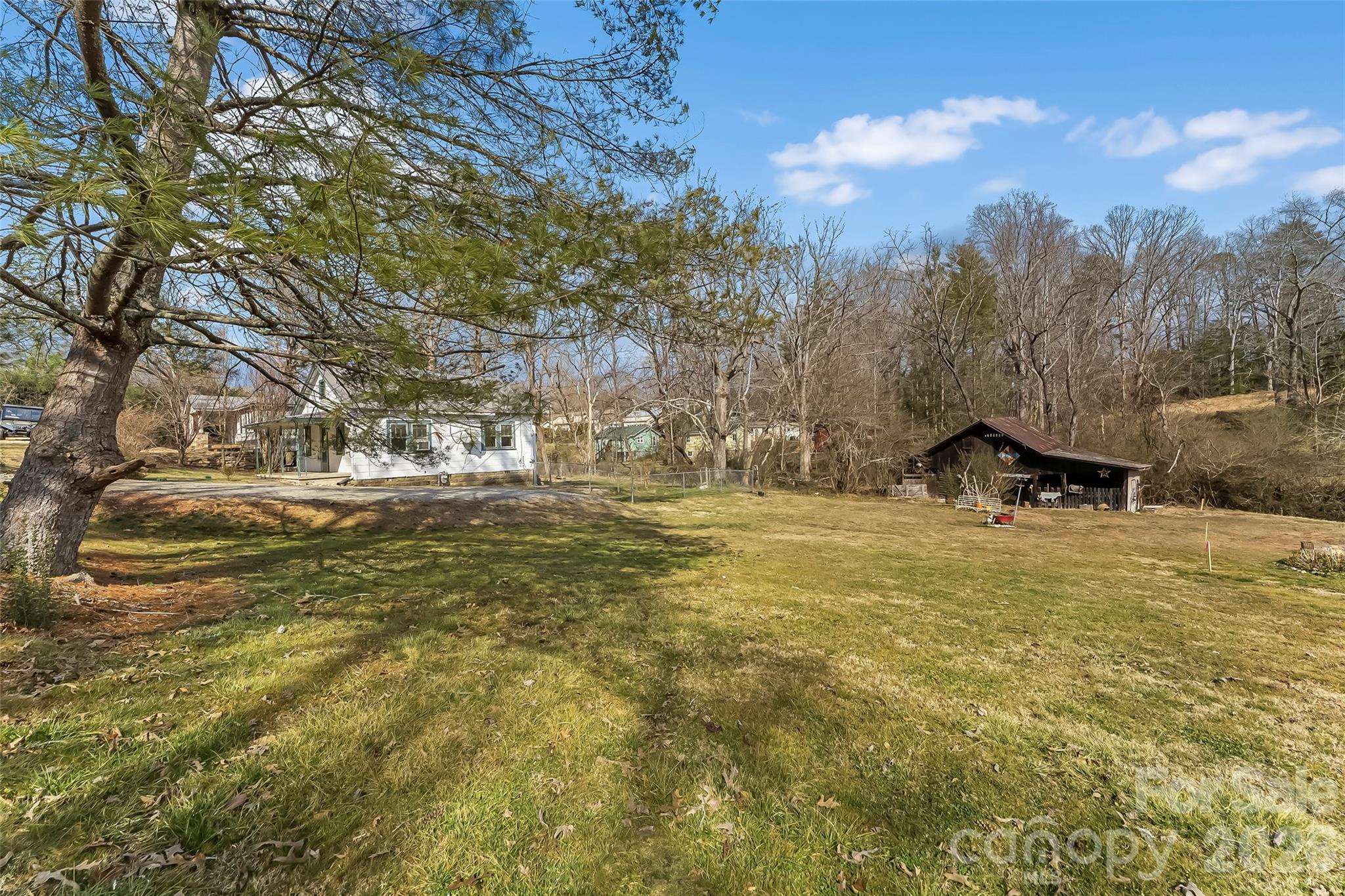 102 Rhododendron Drive Brevard, NC 28712 - Photo 13 of 17 a view of outdoor space with garden and trees