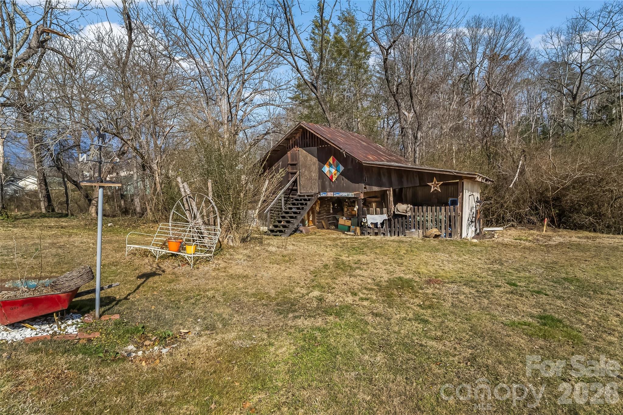 102 Rhododendron Drive Brevard, NC 28712 - Photo 14 of 17 a view of a house with a yard