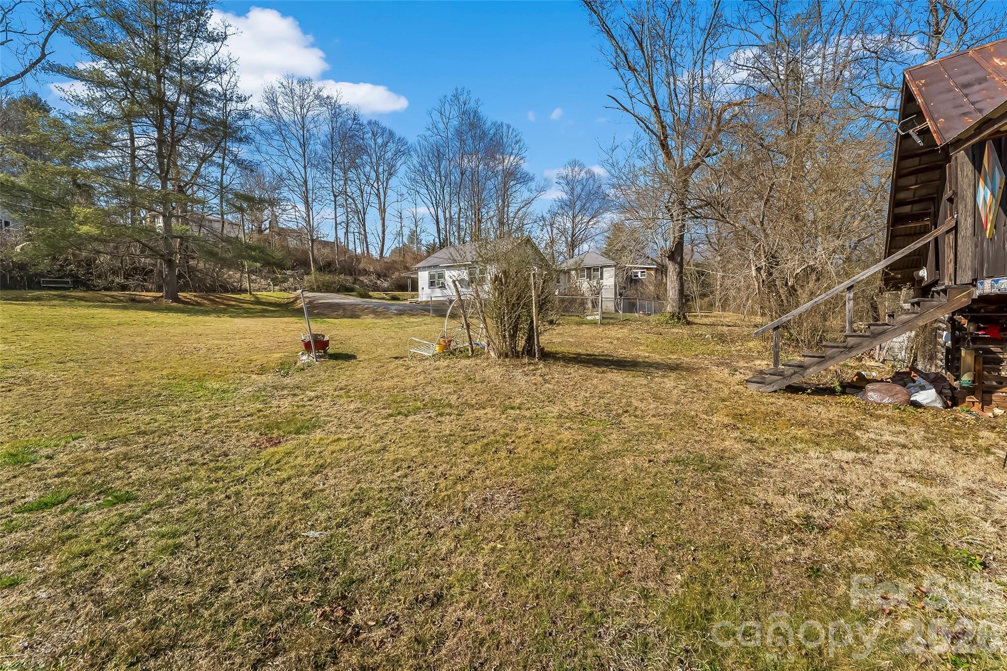 102 Rhododendron Drive Brevard, NC 28712 - Photo 15 of 17 a view of a yard with wooden fence