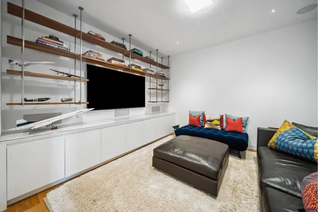 a kitchen view with a table and chairs in it