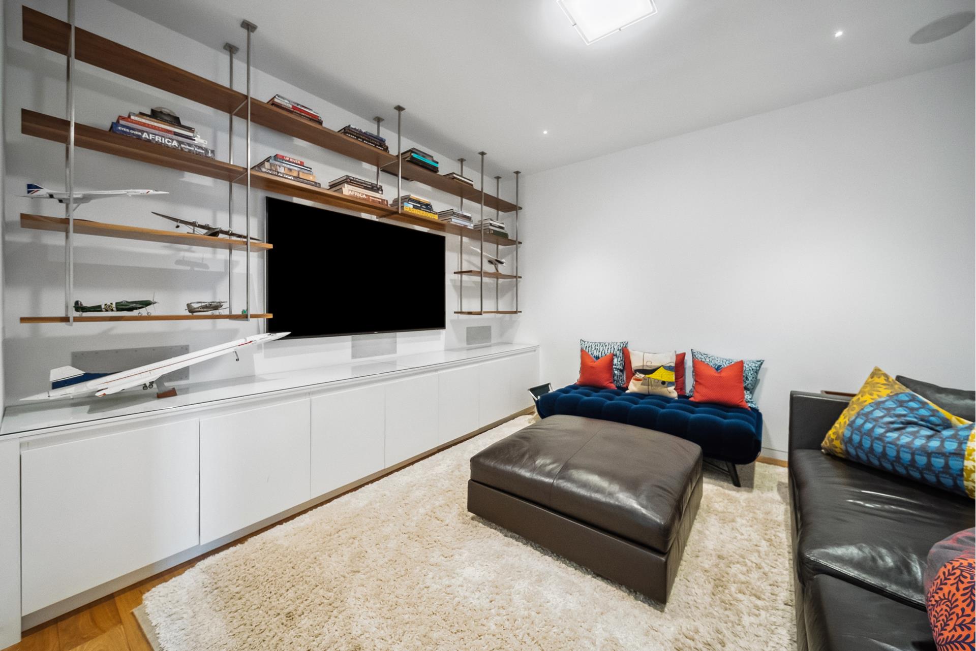 240 Centre Street, Unit 5B Manhattan, NY 10013 - Photo 12 of 37 a living room with furniture and a flat screen tv