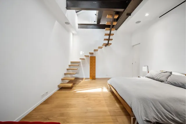 a view of kitchen with a sink and a refrigerator
