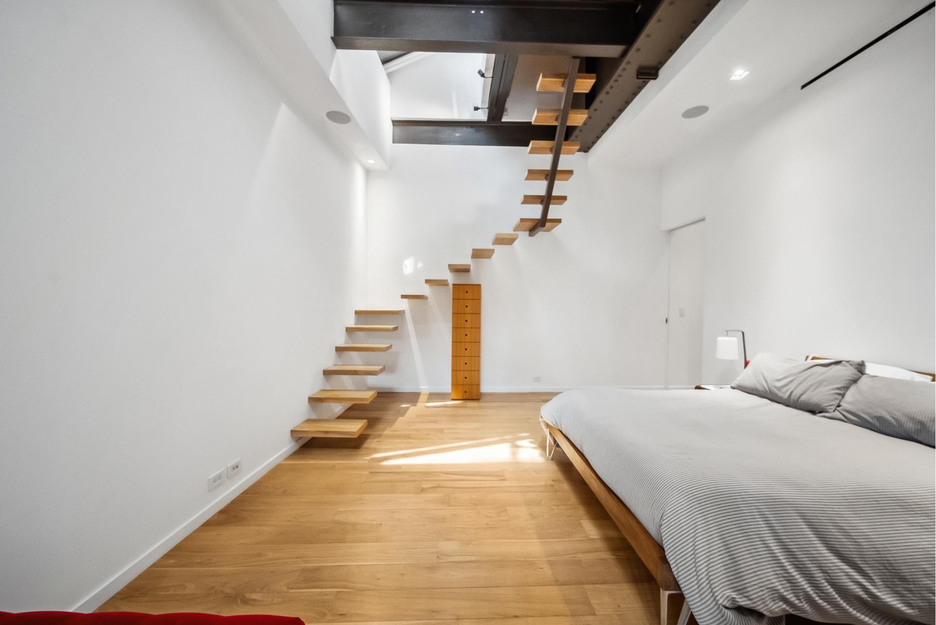 240 Centre Street, Unit 5B Manhattan, NY 10013 - Photo 14 of 37 a bedroom with a bed and white walls