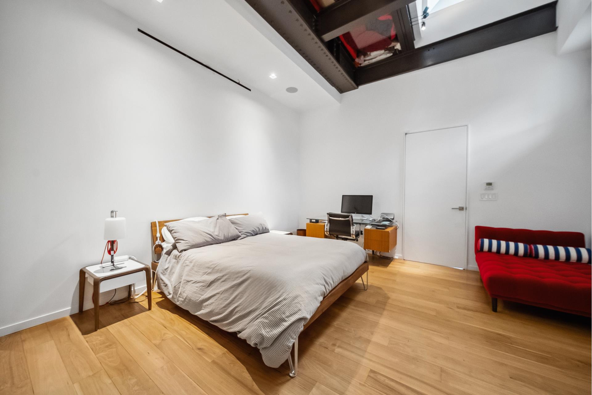 240 Centre Street, Unit 5B Manhattan, NY 10013 - Photo 15 of 37 a bedroom with a bed and a table