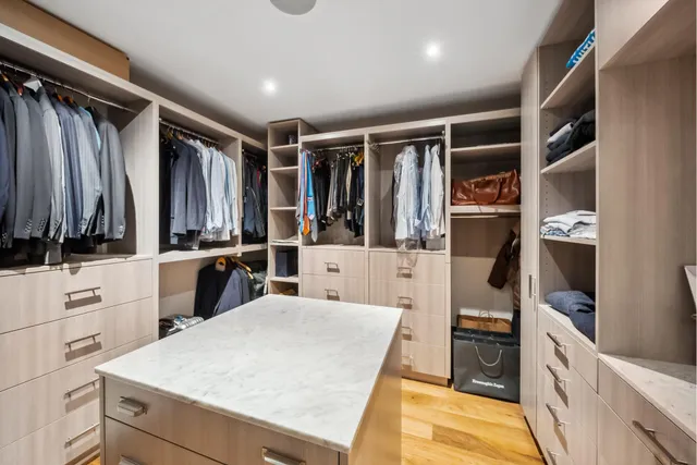 a bedroom with a bed and a table