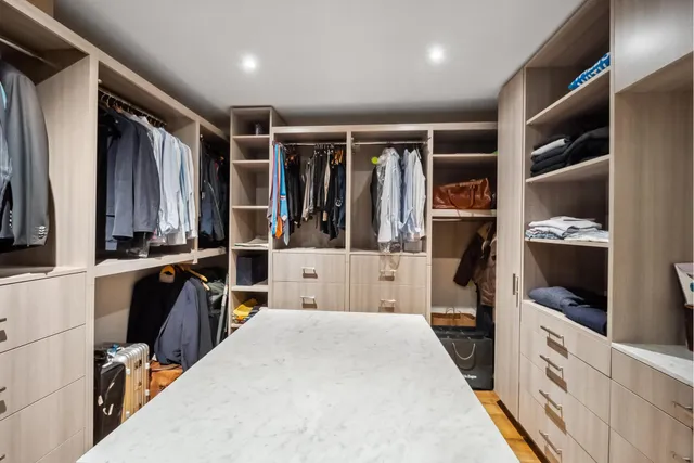 a bedroom with a bed and a desk