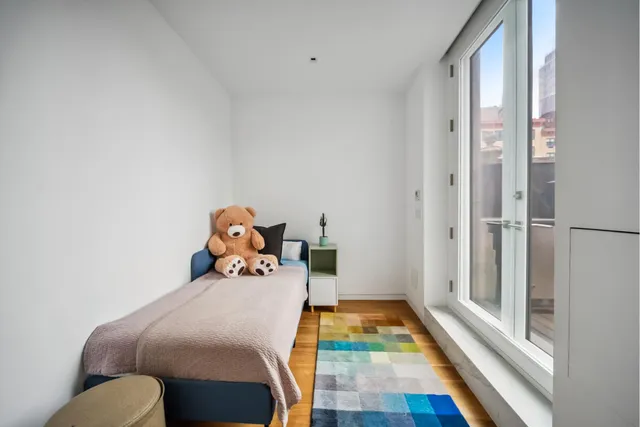 a kitchen with stainless steel appliances kitchen island granite countertop a refrigerator and a stove top oven