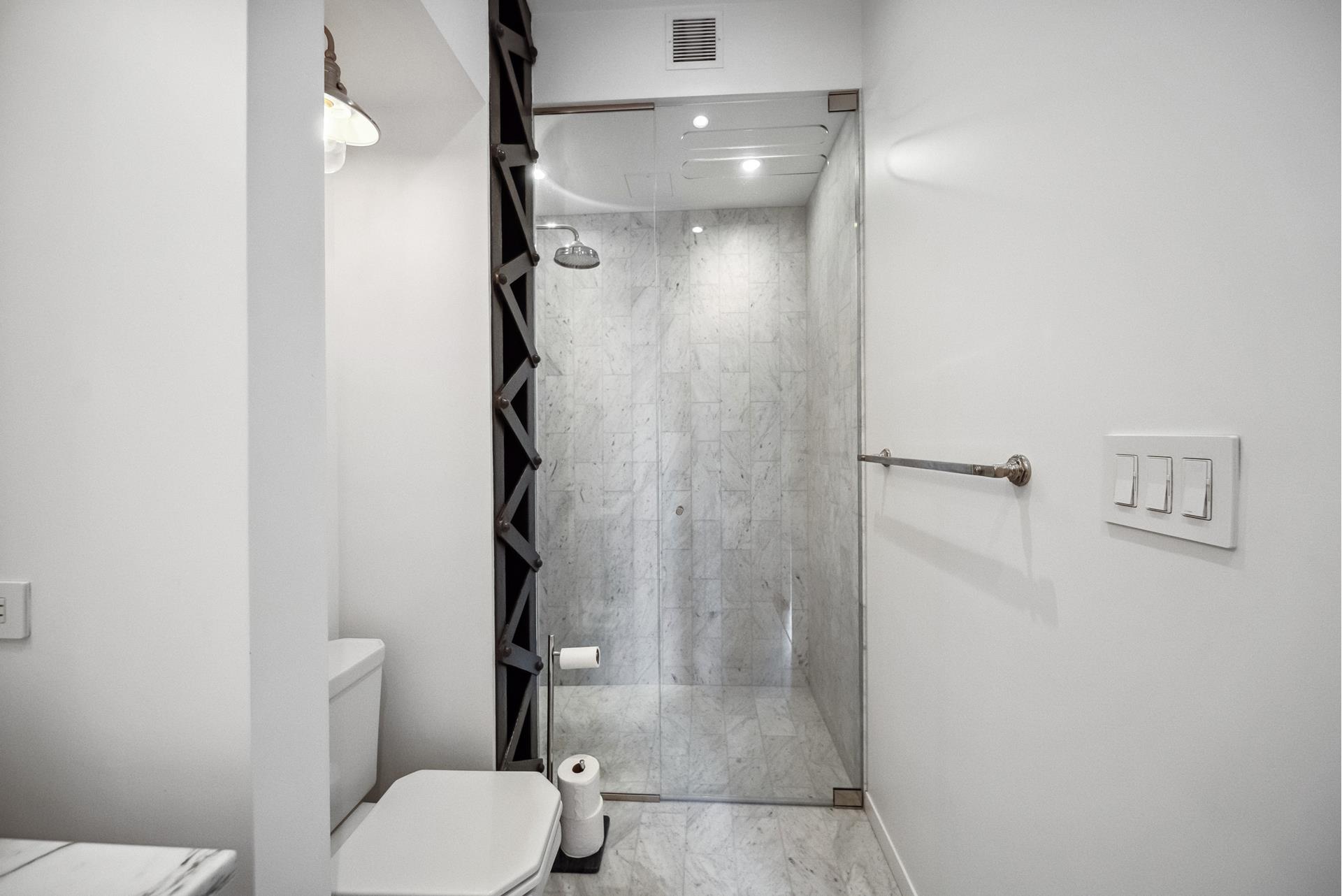 240 Centre Street, Unit 5B Manhattan, NY 10013 - Photo 25 of 37 a bathroom with a toilet and a shower
