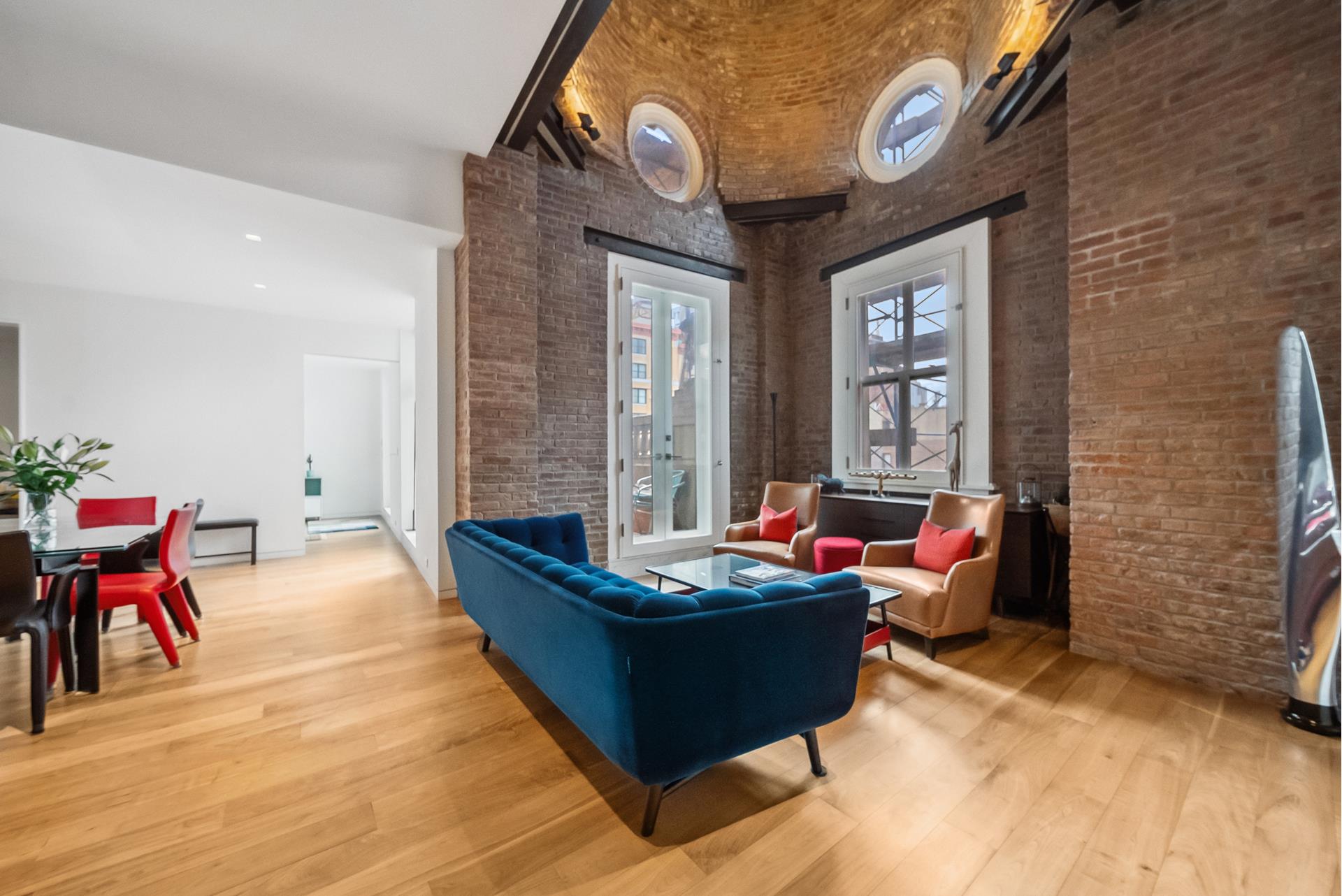 240 Centre Street, Unit 5B Manhattan, NY 10013 - Photo 2 of 37 a living room with furniture and a potted plant
