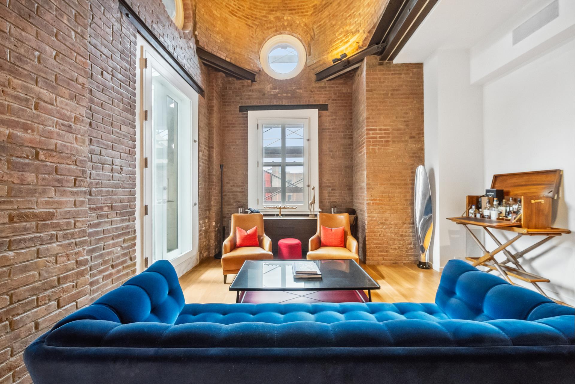 240 Centre Street, Unit 5B Manhattan, NY 10013 - Photo 4 of 37 a living room with furniture and a floor to ceiling window