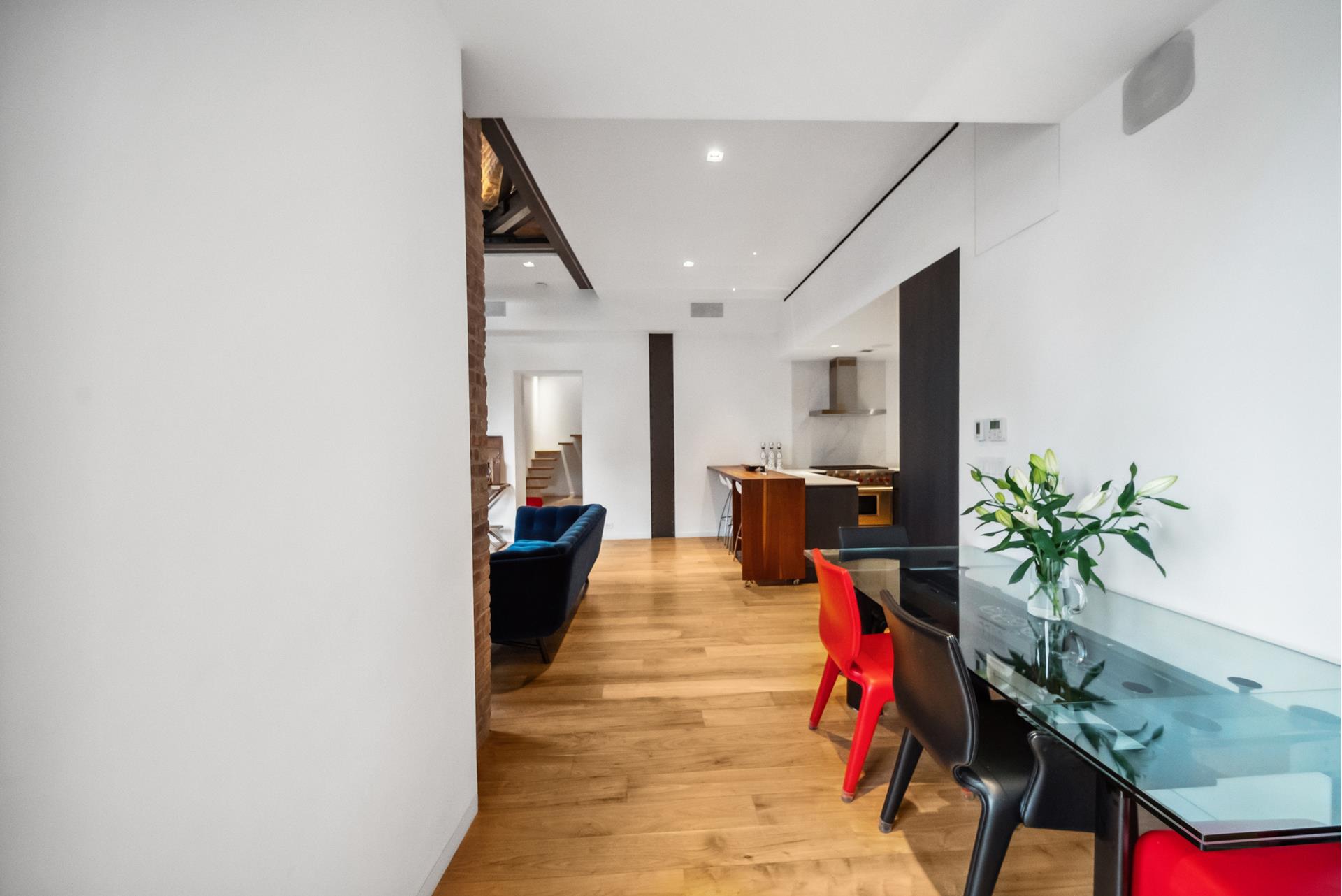 240 Centre Street, Unit 5B Manhattan, NY 10013 - Photo 7 of 37 a living room with furniture and a potted plant
