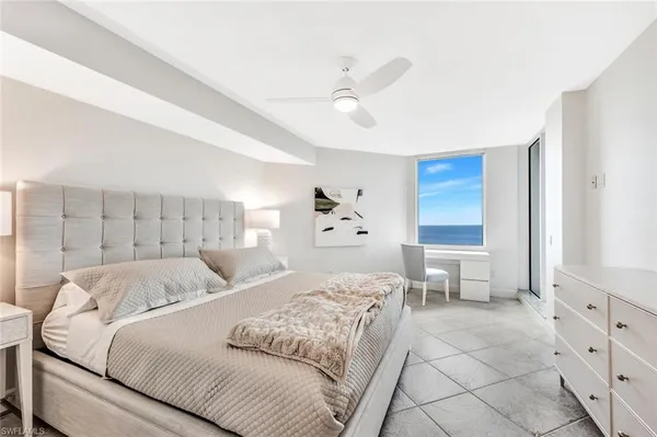 a bed room with a bed and a window