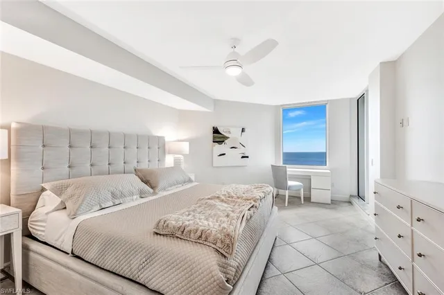 a bed room with a bed and a window