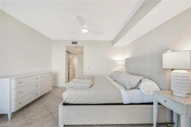 a bedroom with a bed and a night lamp