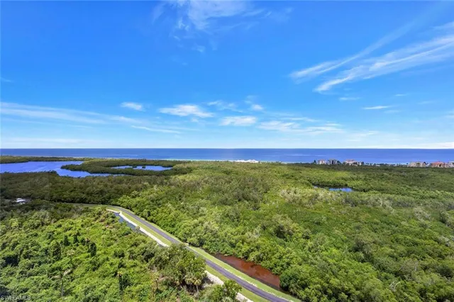 a view of a yard with an ocean view
